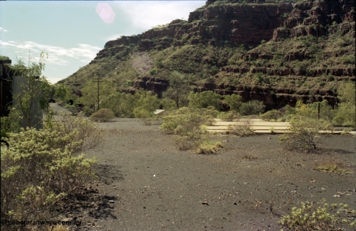 196-28
Wittenoom Gorge, Gorge Mine area, asbestos mining remains, view looking north east from remains of railways and mill towards power station, concrete pad is former workshops.
