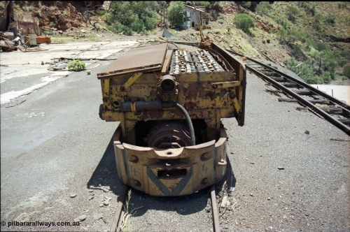 197-13
Wittenoom, Colonial Mine, asbestos mining remains, Mancha battery locomotive #4 looking north west, demolished workshops and office on the left, mine adit doors visible, compressor building in the distance.
Keywords: Mancha;