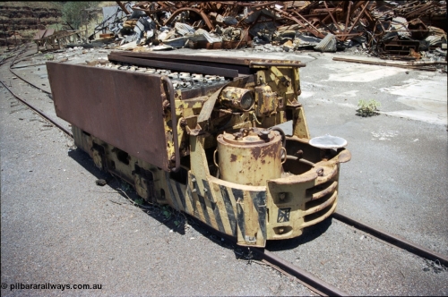 197-16
Wittenoom, Colonial Mine, asbestos mining remains, Mancha battery locomotive #4 looking south east, demolished workshops and office behind with the battery charging shed remains in the distance. Drivers seat, brake wheel and controller visible.
Keywords: Mancha;