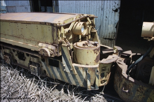 197-34
Wittenoom, Colonial Mine, view of the drivers 'cab' of a Mancha locomotive, view of drivers seat, brake wheel, controller and battery module with the number 2933 on it.
Keywords: Mancha;