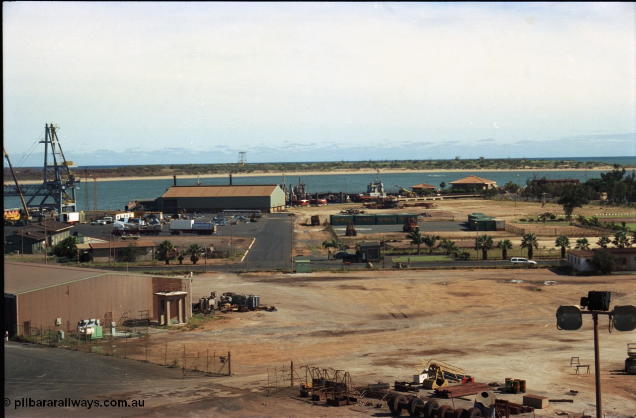 198-27
Port Hedland Port, view across hard stand area, shows tug pen and BHP Transport admin building, locals will also notice Customs House, new bulk loader under construction.
