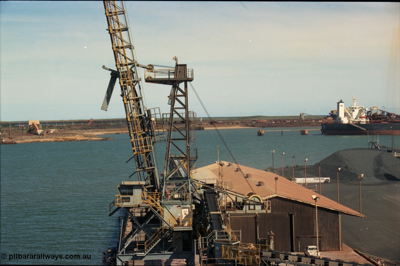 198-29
Port Hedland Port, view of Cargill Salt loader on No. 3 Berth, BHP under-harbour tunnel portal and overland conveyor for HBI plant visible along with Finucane Island, 2001.
