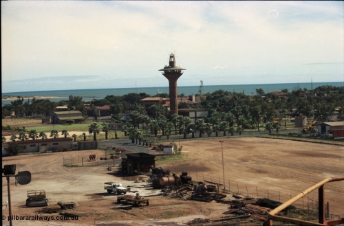 198-26
Port Hedland Port, view of Port Control Tower, grassed area with shed is for helicopter operator, the Esplanade Hotel can also be seen along with the lookout tower behind the visitors centre.
