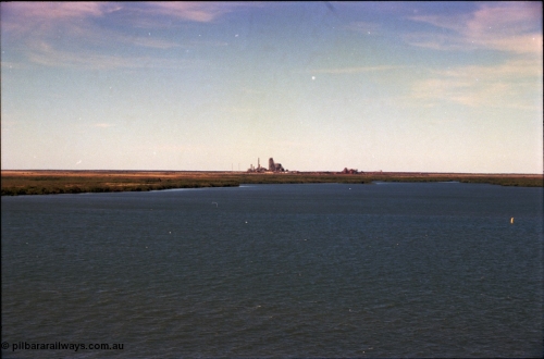 198-31
Port Hedland Port, view across harbour with now demolished HBI plant in the background, this plant was flattened in October 2011, this view is 2001, FMG have now built berths in this area and Roy Hill have a couple on the right.
