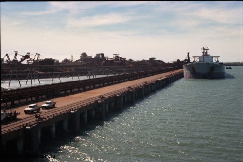 198-36
Port Hedland Port, BHP Nelson Point view of A Berth looking towards Berth B with vessel being loaded on B Berth by Shiploader One.
