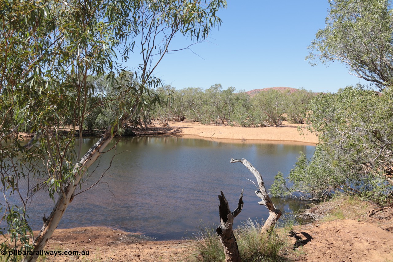 140517-4326
Eginbah Siding area, of the Marble Bar railway, former locomotive watering stop alongside the Talga River (closed in 1951), view of one of the pools water was drawn from, view looking north from the alignment over the river. [url=https://goo.gl/maps/kRCgSaoHC1m]Location here[/url].
