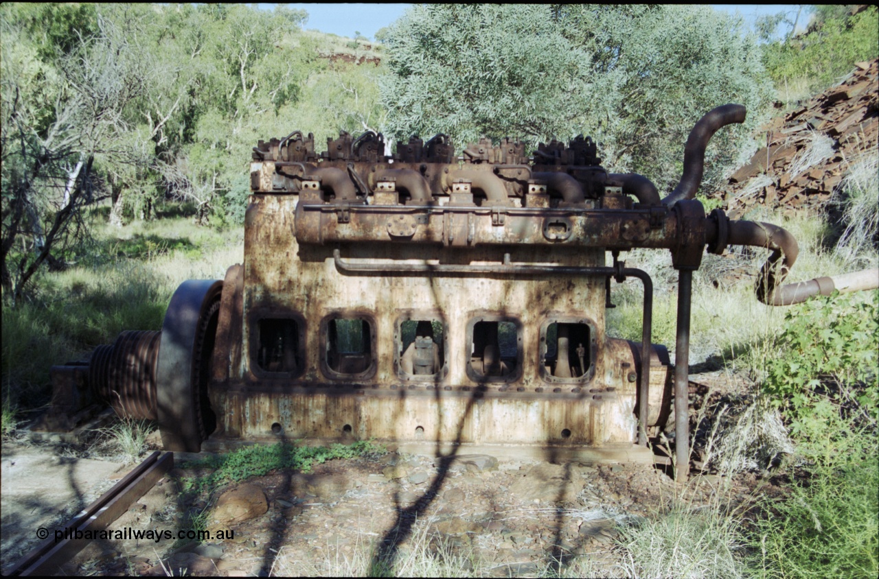 203-32
Yampire Gorge, remains of asbestos mining, 5 cylinder diesel motor with drive pulley and fly wheel, possibly an air compressor.
