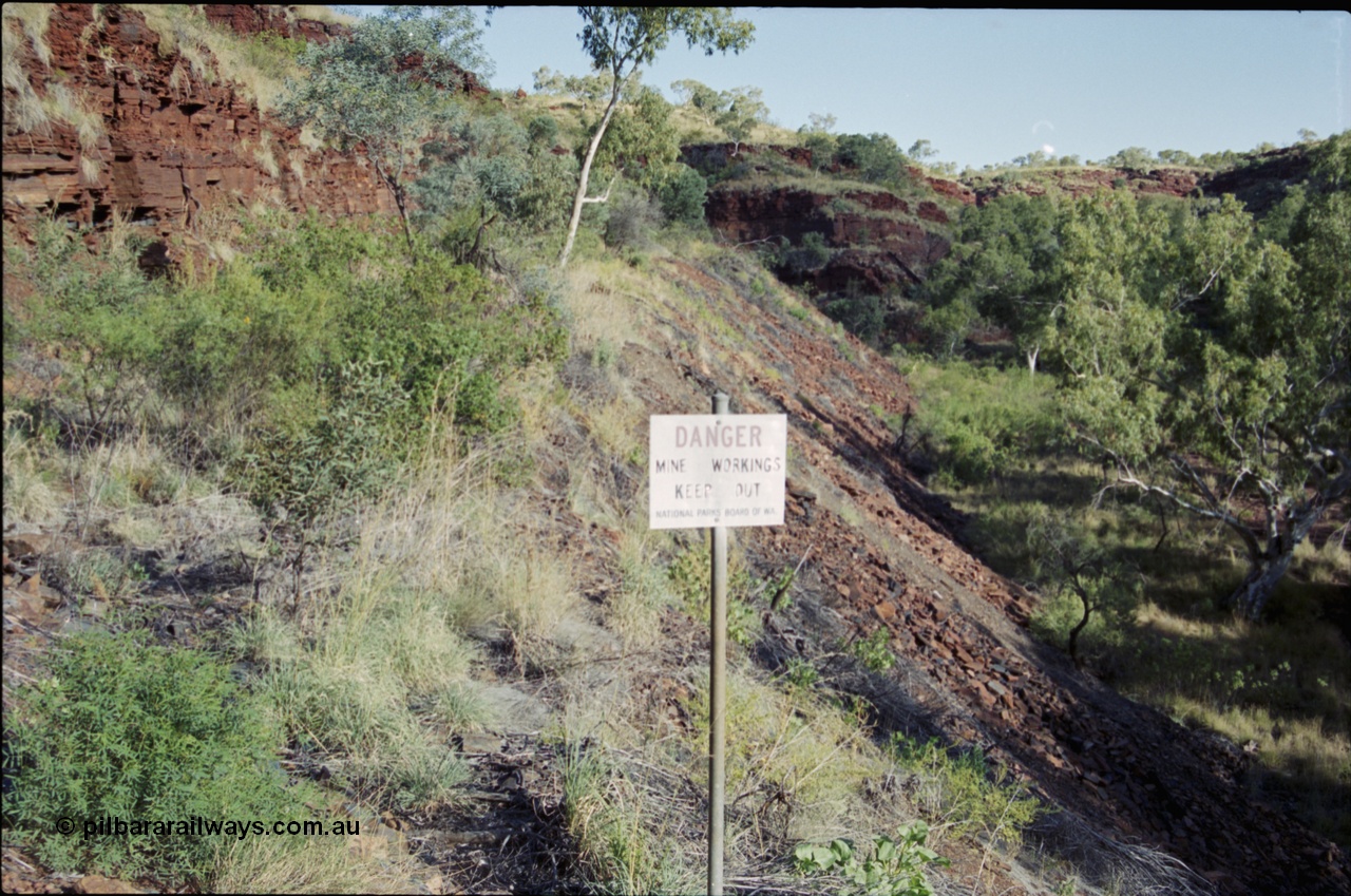 203-35
Yampire Gorge, remains of asbestos mining, former roadway over grown with sign from the National Parks Board of WA.
