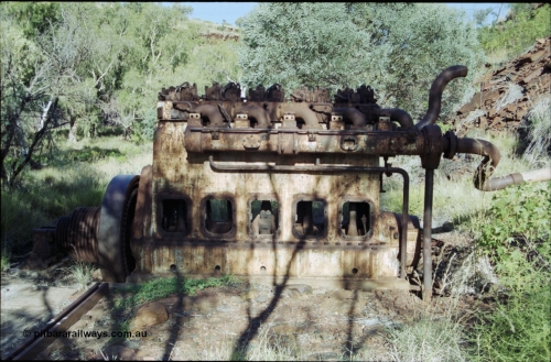 203-32
Yampire Gorge, remains of asbestos mining, 5 cylinder diesel motor with drive pulley and fly wheel, possibly an air compressor.
