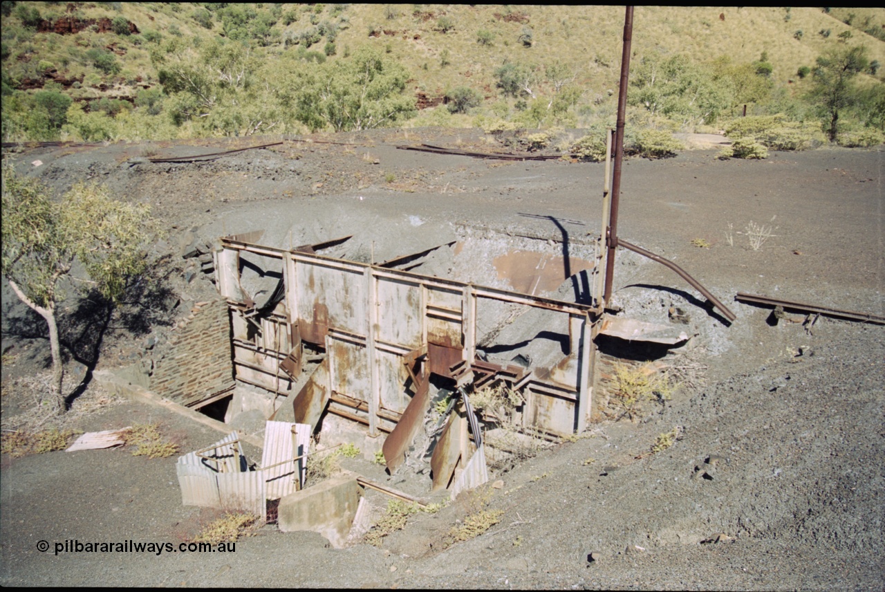 204-25
Wittenoom Gorge Mine, remains of asbestos mining, view of the unloading area with the hoppers and chutes where the underground tipping ore cars were emptied.
