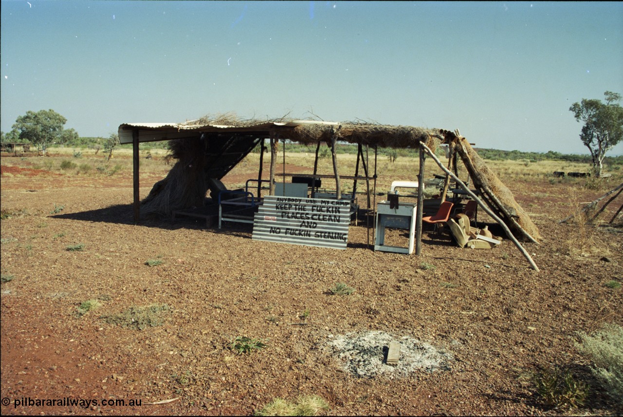205-01
Roebourne - Wittenoom Road, Chichester Downs, camp located 4 km east of Rio Tinto railway, sign says it all.
