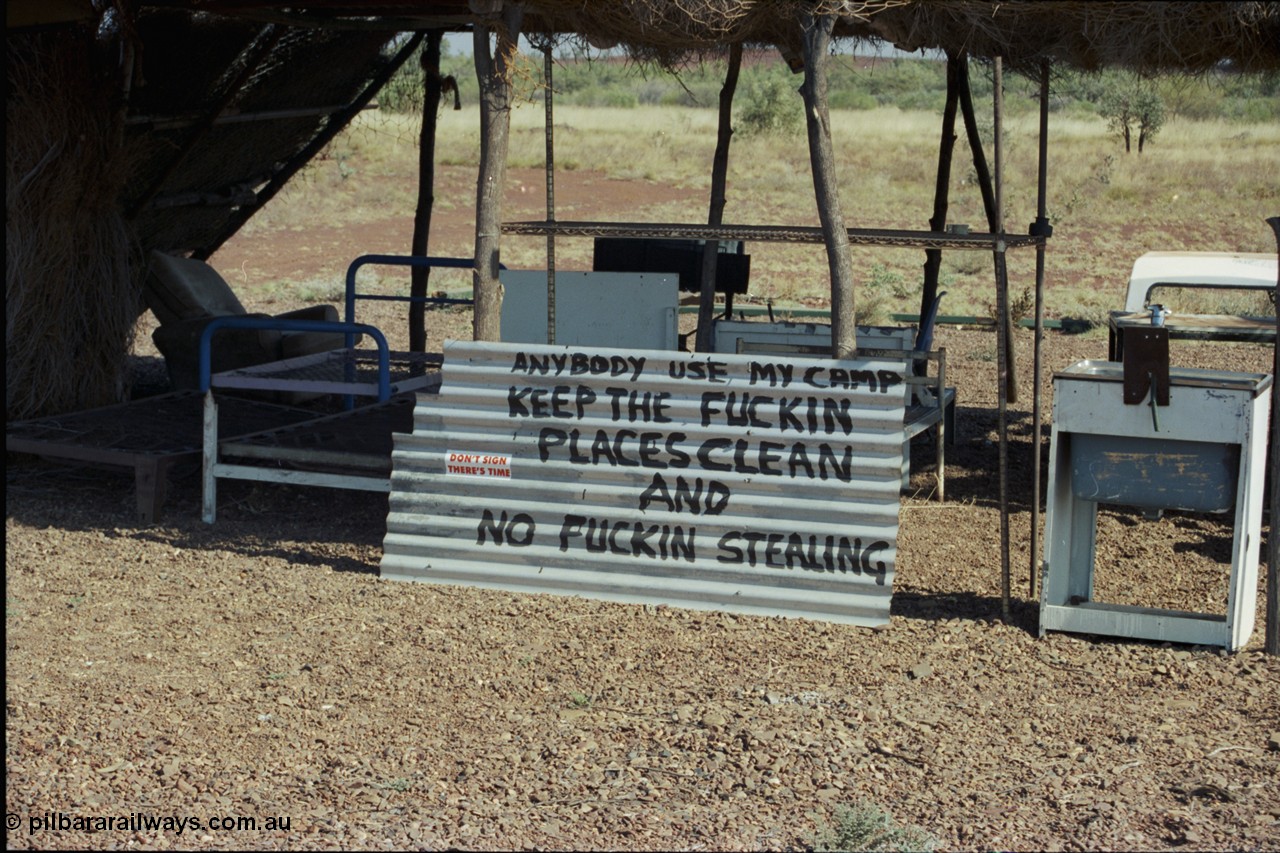 205-02
Roebourne - Wittenoom Road, Chichester Downs, camp located 4 km east of Rio Tinto railway, sign says it all.
