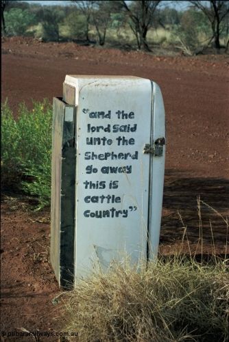 205-04
Hooley Station front gate, old refrigerator used for mailbox, 'and the lord said unto the Shepard go away this is cattle country'.
