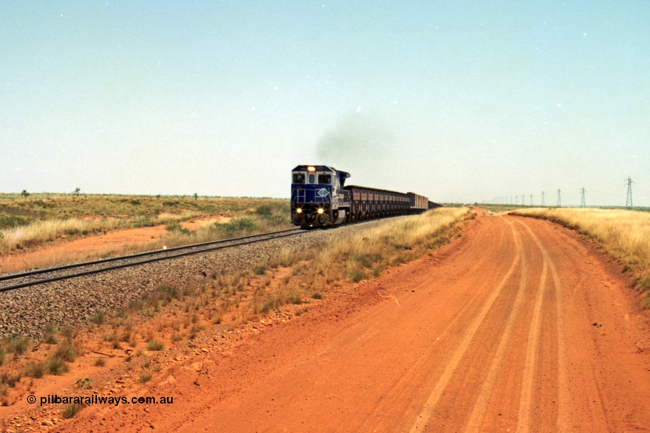 206-26
An empty train on the Yarrie (former Goldsworthy) line behind BHP 5633 'Hephaestus' built new in 1988 by Goninan as a GE CM39-8 model, serial 5831-12 / 88-082. The four CM39-8 units were upgraded to CM40-8 units following overhauls and finally scrapped in January 2016.
Keywords: 5633;Goninan;GE;CM39-8;5831-12/88-082;