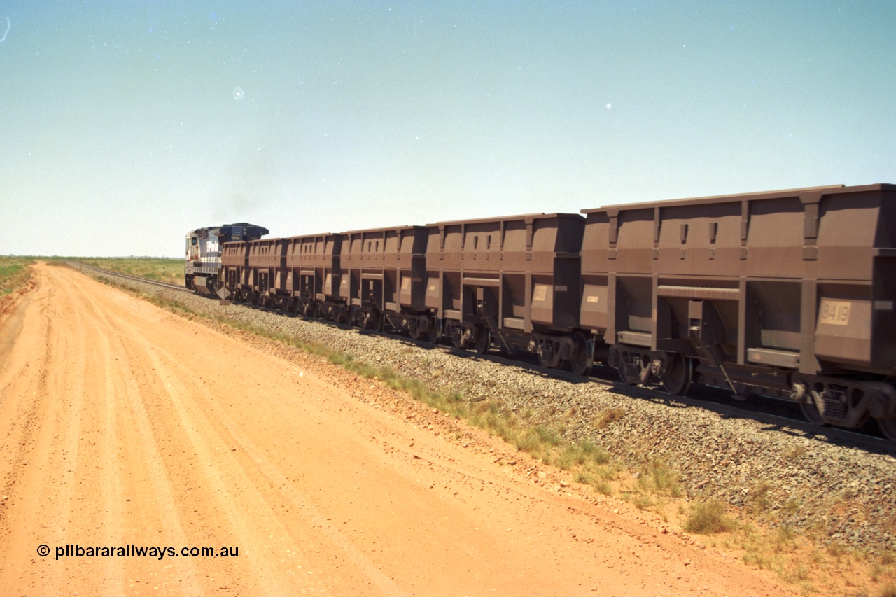 206-31
An empty train on the Yarrie (former Goldsworthy) line behind BHP 5633 'Hephaestus' with a string of Golynx ore waggons, built by Goninan WA to a Lynx Engineering design, these are belly dump waggons as opposed to the BHP fleet of rotary dump bodies.
Keywords: 8419;Goninan-Golynx;BHP-ore-waggon;