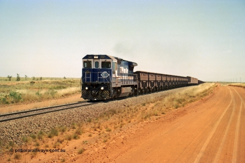 206-28
An empty train on the Yarrie (former Goldsworthy) line behind BHP 5633 'Hephaestus' built new in 1988 by Goninan as a GE CM39-8 model, serial 5831-12 / 88-082. The four CM39-8 units were upgraded to CM40-8 units following overhauls and finally scrapped in January 2016.
Keywords: 5633;Goninan;GE;CM39-8;5831-12/88-082;