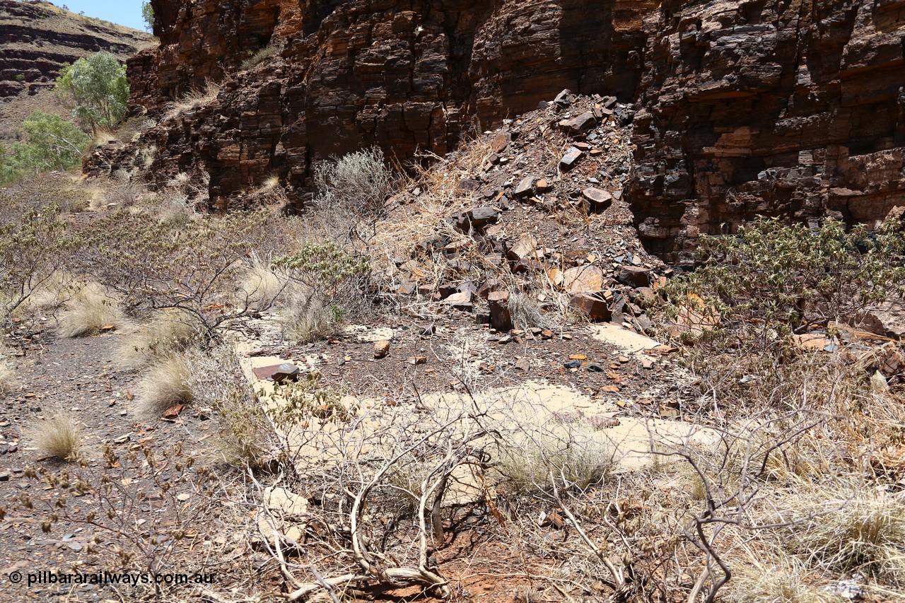 160101 9793
Wittenoom Gorge, Gorge Mine area, asbestos mining remains, concrete slab of former building located along the mine railway, adit 3 is behind the pile of rubble. [url=https://goo.gl/maps/46bmN7VJPj12]Geodata[/url].
