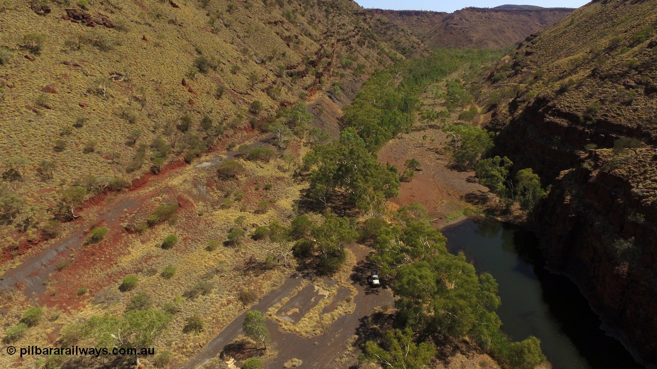 160102 DJI 0039
Wittenoom Gorge, view looking north east over the remains of the footings and slabs of the Gorge Mine location with the drive ramp up the left wall, pool in Joffre Creek on the right. [url=https://goo.gl/maps/KpQRGCBiDbrjskJd9]Geodata[/url].
