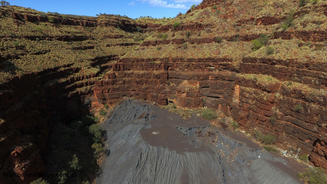 160103 DJI 0064
Colonial Mill and mine ruins located within Wittenoom Gorge. A number of mine adits or entry points are visible on this level along with the large amount of tailings, office structures and railway points and track visible. See images of the site intact [url=http://www.pilbararailways.com.au/gallery/thumbnails.php?album=117] here [/url], 194-08 shows the sealed red entry point. Geodata: [url=https://goo.gl/maps/xchrTph8qXttr3d26]-22.314205, 118.317905[/url].

