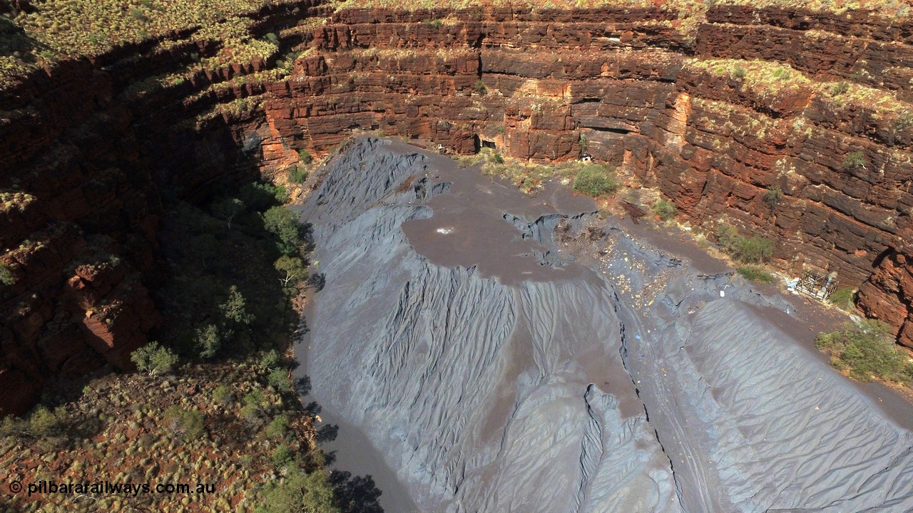 160103 DJI 0065
Colonial Mill and mine ruins located within Wittenoom Gorge. A number of mine adits or entry points are visible on this level along with the large amount of tailings, office structures and railway points and track visible. See images of the site intact [url=http://www.pilbararailways.com.au/gallery/thumbnails.php?album=117] here [/url], 194-08 shows the sealed red entry point. Geodata: [url=https://goo.gl/maps/xchrTph8qXttr3d26]-22.314205, 118.317905[/url].
