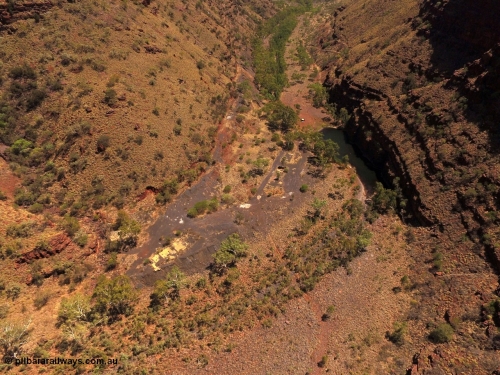 160101 DJI 0017
Wittenoom Gorge, view from above the Gorge Mine area and pool, looking north east, campers at pool, the drive can be seen cutting up the left side of the gorge, foot print of mine and building area clearly visible. [url=https://goo.gl/maps/tFzc7cw2fpB3MDRP9]Geodata[/url].
