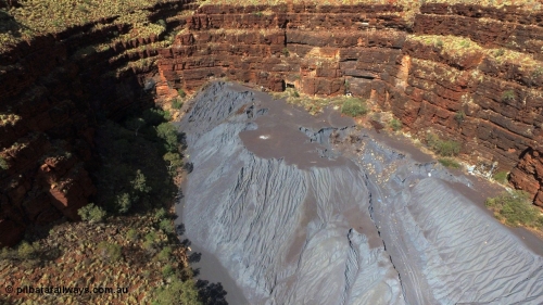 160103 DJI 0065
Colonial Mill and mine ruins located within Wittenoom Gorge. A number of mine adits or entry points are visible on this level along with the large amount of tailings, office structures and railway points and track visible. See images of the site intact [url=http://www.pilbararailways.com.au/gallery/thumbnails.php?album=117] here [/url], 194-08 shows the sealed red entry point. Geodata: [url=https://goo.gl/maps/xchrTph8qXttr3d26]-22.314205, 118.317905[/url].
