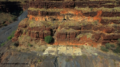 160103 DJI 0069
Colonial Mill and mine ruins located within Wittenoom Gorge. The large concrete area on the upper level is the former mining offices and railway workshops, a sharp eye will see the sealed mine entry with a red door. See images of the site intact [url=http://www.pilbararailways.com.au/gallery/thumbnails.php?album=117] here [/url], 194-08 shows the sealed red entry point. Geodata: [url=https://goo.gl/maps/BD1BiF3pHTr] -22.3112605 118.3190326 [/url].
