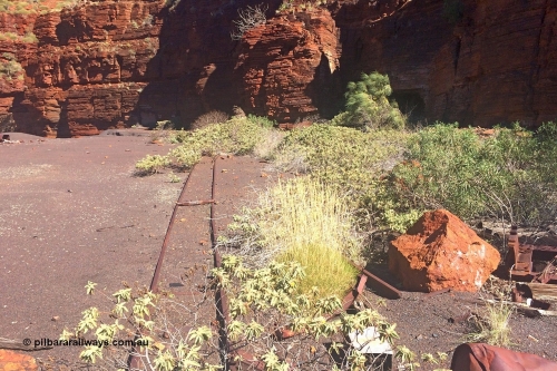 160710 iPh5S 2813
Wittenoom Gorge, Colonial Mine, upper level looking across to adits 27 and 28, sleeper pile to the right, track leading away to adits 27 and 28.
