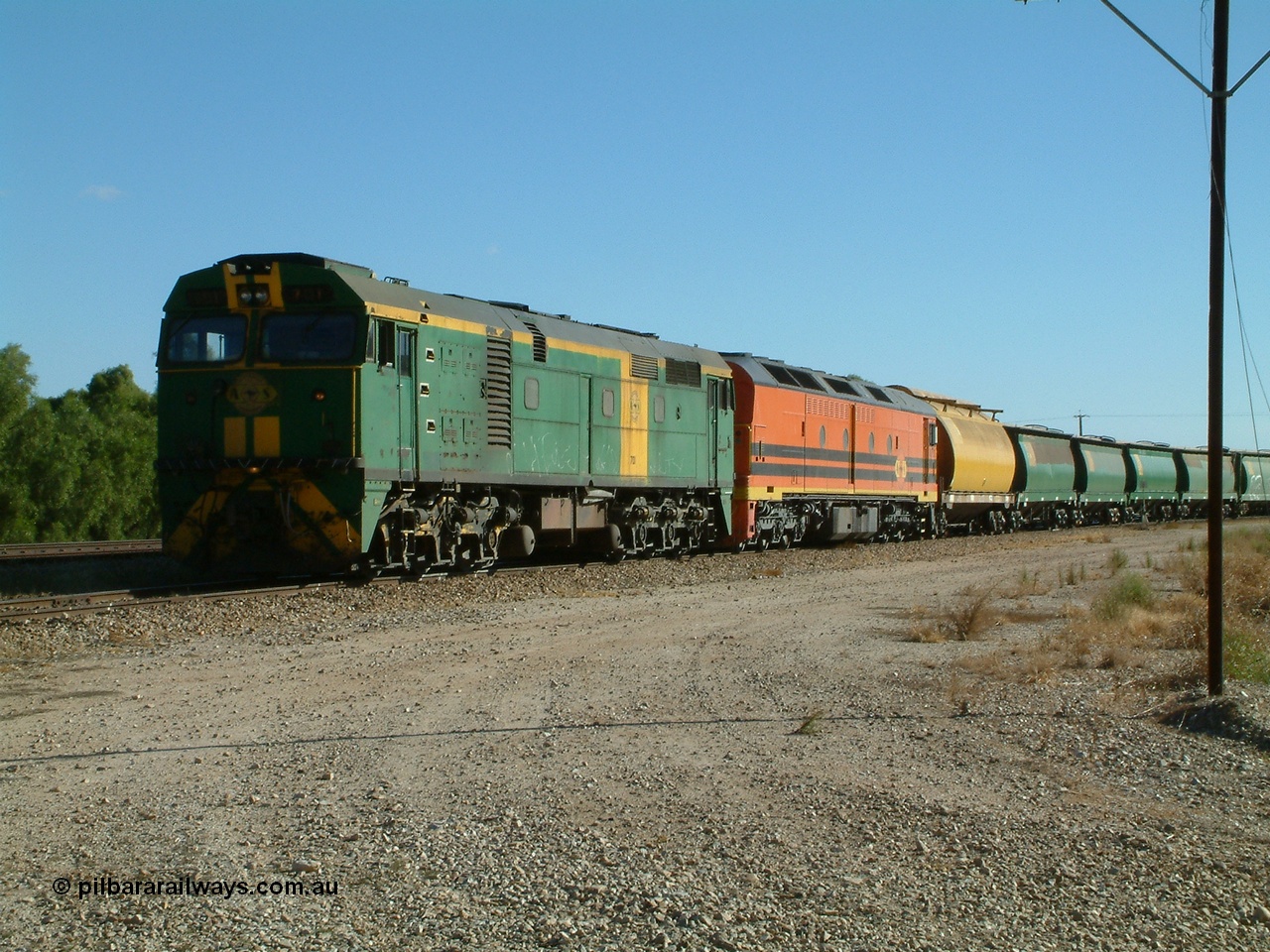 030403 154420
Gladstone, former South Australian Railways AE Goodwin built DL500G ALCo designated the 700 class, class leader 701 serial G6042-2 leads a grain train with an ALF class and first waggon a former WAGR WW now WWS grain waggon, train being loaded on the 3rd April 2003.
Keywords: 700-class;701;G6042-2;AE-Goodwin;ALCo;DL500G;