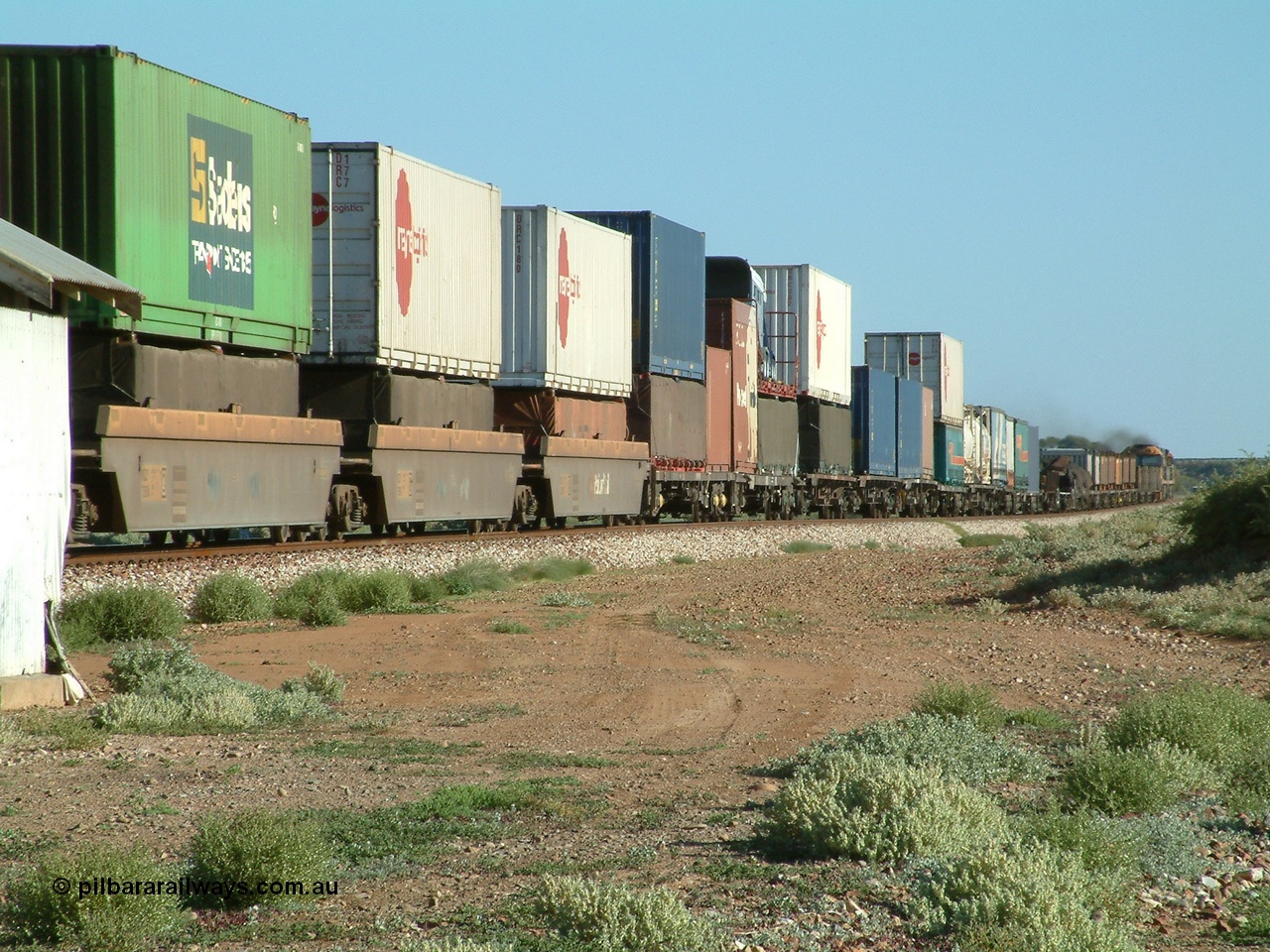 030404 082851
Port Germein, Perth bound steel and intermodal hurries through on the main behind National Rail's NR class units, showing one and a half stacking. 4th April 2003.
