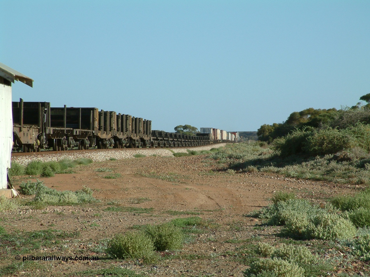 030404 083001
Port Germein, Perth bound steel and intermodal hurries through on the main with empty steel loading on the rear. 4th April 2003.
