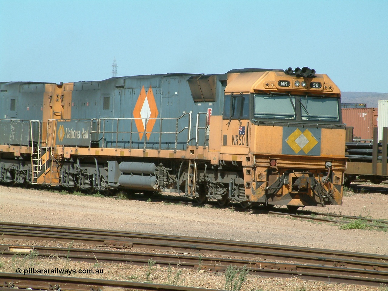 030404 103712
Port Augusta Spencer Junction yard, National Rail Goninan built GE Cv40-9i model NR class unit NR 50 serial 7250-08 / 97-252 lay about the yard in between jobs. 4th April 2003.
Keywords: NR-class;NR50;7250-08/97-252;Goninan;GE;Cv40-9i;