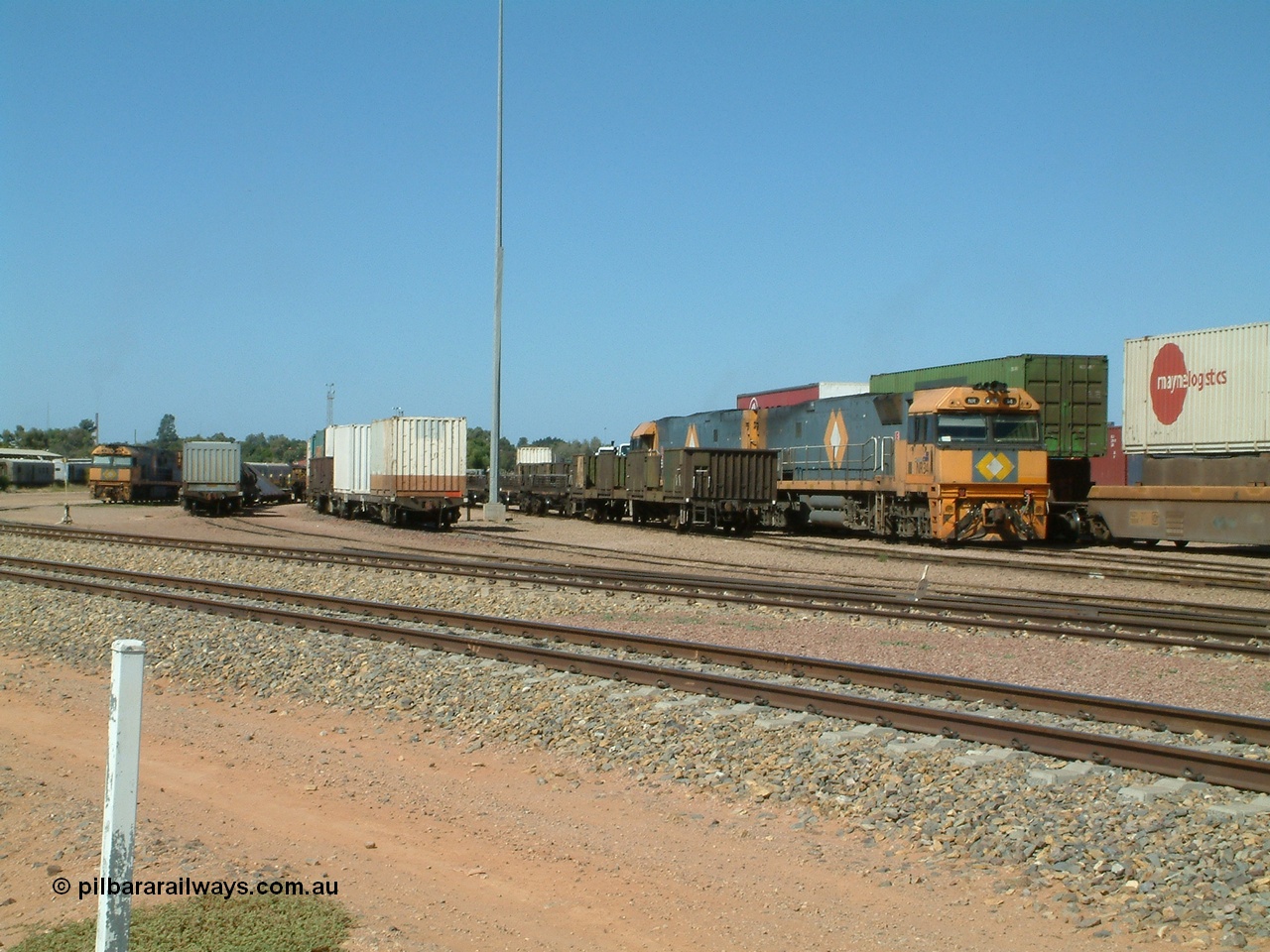 030404 103950
Port Augusta Spencer Junction yard, view looking south with various waggon consists and NR class locomotives present. 4th April 2003.
