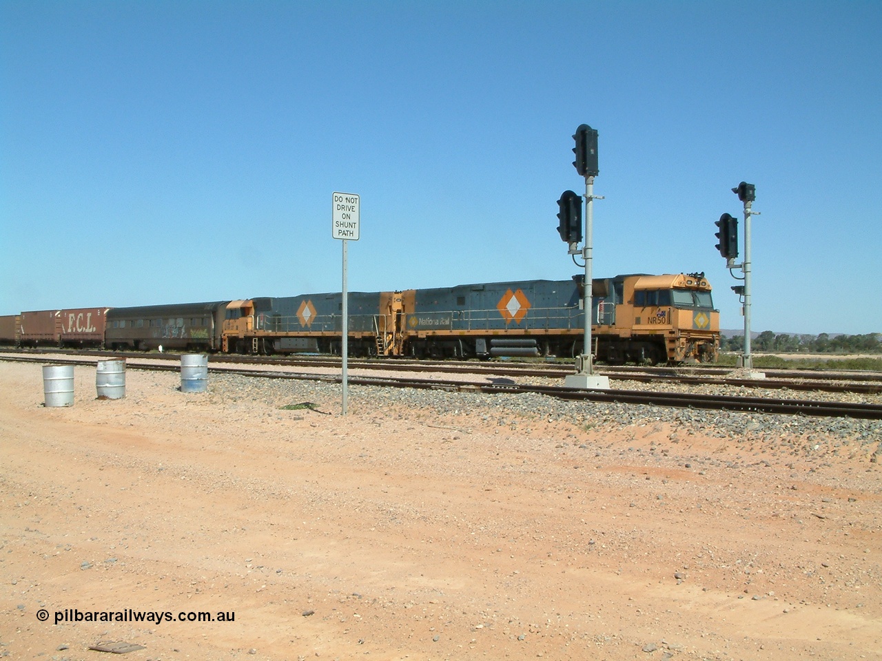 030404 125017
Port Augusta Spencer Junction yard, a Perth bound intermodal awaits departure time on 13 Road behind National Rail NR class units built by Goninan as GE Cv40-9i models, NR 50 serial 7250-08 / 97-252 and NR 37 serial 7250-06 / 97-239. 4th April 2003.
Keywords: NR-class;NR50;Goninan;GE;Cv40-9i;7250-08/97-252;