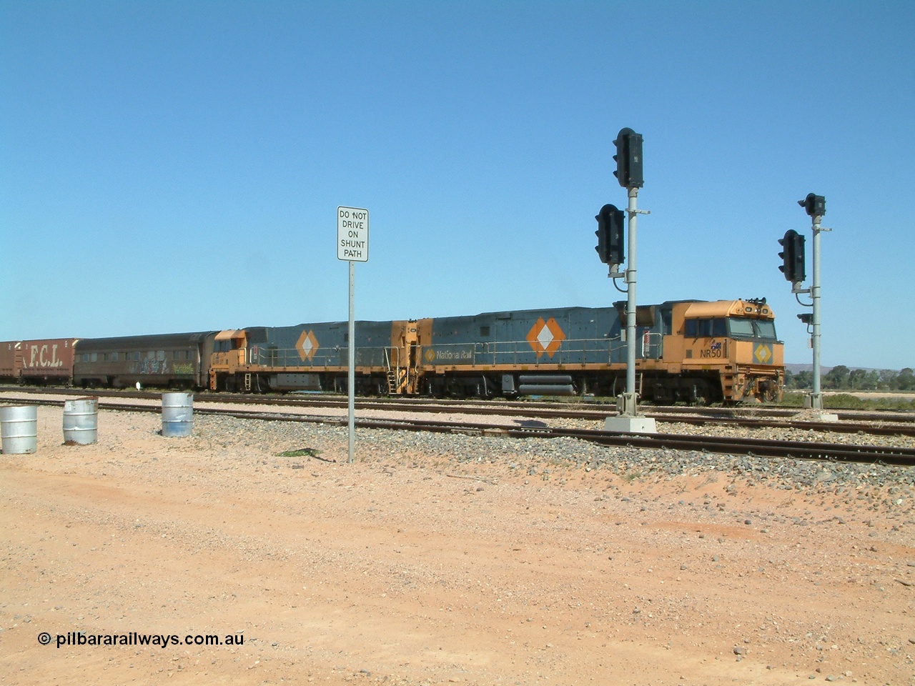 030404 125029
Port Augusta Spencer Junction yard, a Perth bound intermodal awaits departure time on 13 Road behind National Rail NR class units built by Goninan as GE Cv40-9i models, NR 50 serial 7250-08 / 97-252 and NR 37 serial 7250-06 / 97-239. 4th April 2003.
Keywords: NR-class;NR50;7250-08/97-252;Goninan;GE;Cv40-9i;