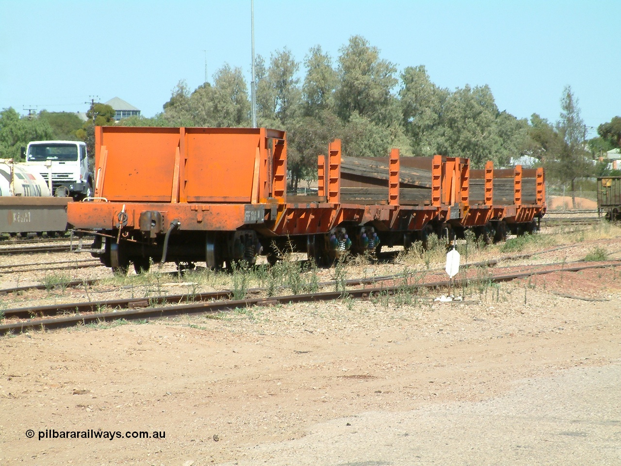 030404 130919
Port Augusta Spencer Junction yard, a couple of AFRF type rail transport waggons await shunting back to Whyalla for reloading during the Darwin line construction. 4th April 2003.
Keywords: AFRF-type;