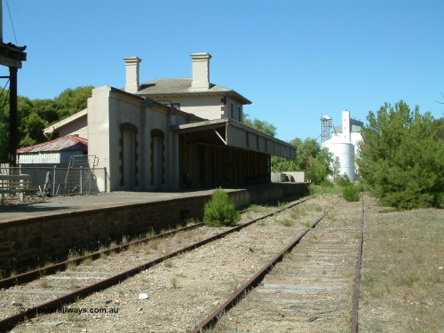 030403 111454
Kapunda railway station building looking south east with silos in the distance.
