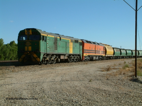 030403 154420
Gladstone, former South Australian Railways AE Goodwin built DL500G ALCo designated the 700 class, class leader 701 serial G6042-2 leads a grain train with an ALF class and first waggon a former WAGR WW now WWS grain waggon, train being loaded on the 3rd April 2003.
Keywords: 700-class;701;AE-Goodwin;ALCo;DL500G;G6042-2;