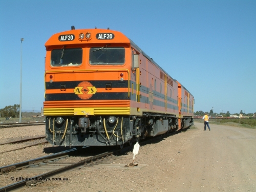 030404 141115
Port Augusta Spencer Junction yard, MKA (Morrison Knudsen Australia) rebuilt AL class AL 24 into EMD JT26C-2M model for Australian National in 1993 as the ALF class, here ALF 20 serial 94-AB-020 shunts empty rail transport waggon sets from the Darwin construction. 4th April, 2003.
Keywords: ALF-class;ALF20;MKA;EMD;JT26C-2M;94-AN-020;rebuild;AL-class;AL24;Clyde-Engineering;EMD;JT26C;76-840;