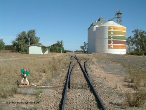 030405 145520
Warramboo, yard overview looking south with siding point levers and indicators, station building on left and Ascom style silo complex in front of concrete SACBH silo complex, April 5, 2003.
