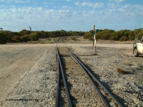 030406 082802
Murdinga, track view looking south across the grade crossing for Murlong Rd, points, indicator and lever, 6th April 2003.
