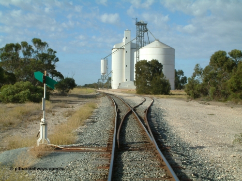 030406 083954
Tooligie, yard overview looking south from the north end points, point lever and indicator, Ascom style silo complex with outflow hopper and spout, Block 2, with concrete silo complex, Block 1, beside them. 6th April 2003.

