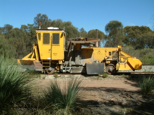 030406 110810
Coomunga, stabled on the siding, Transfield track machine ballast regulator. 6th April 2003.
Keywords: track-machine;