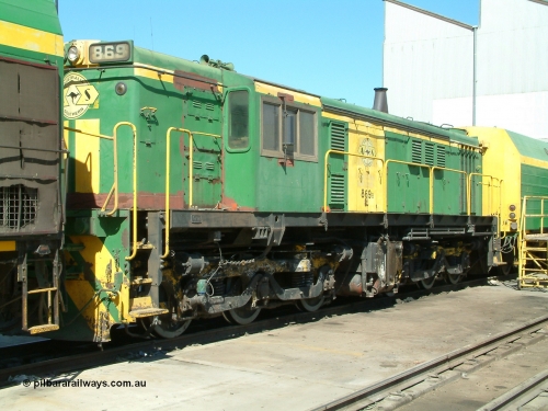 030406 113830
Port Lincoln loco workshops, still wearing the former owner's AN livery, Australian Southern locomotive 830 class 869 AE Goodwin ALCo model DL531 serial G6016-05 with the check letter of B, sandwiched between two NJ class units. 6th April 2003.
Keywords: 830-class;869;AE-Goodwin;ALCo;DL531;G6016-5;
