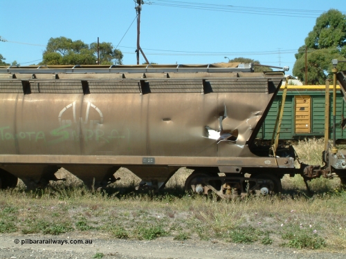 030406 115530
Port Lincoln, derailment damaged SAR Islington Workshops built HAN type bogie wheat waggon HAN 4, close up of non-handbrake end damage, stored at the workshops yards. 6th April 2003.
Keywords: HAN-type;HAN4;1969-73/68-4;SAR-Islington-WS;