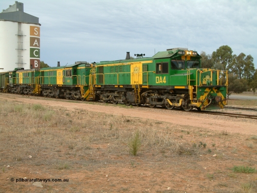 030407 082237
Wudinna, empty grain train behind a trio of former Australian National locomotives with rebuilt former AE Goodwin ALCo model DL531 830 class ex 839, serial 83730, rebuilt by Port Augusta Workshops to DA class, DA 4 leading two AE Goodwin ALCo model DL531 830 class units 842, serial 84140 and 851 serial 84137, 851 having been on the Eyre Peninsula since delivered in 1962, to shunt off empty waggons into the grain siding. 7th April 2003.
Keywords: DA-class;DA4;83730;Port-Augusta-WS;ALCo;DL531G/1;830-class;839;rebuild;