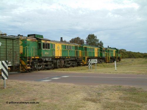 030407 082730
Wudinna, empty grain train shunts back across Gooch Tce grade crossing with a trio of former Australian National locomotives with rebuilt former AE Goodwin ALCo model DL531 830 class ex 839, serial 83730, rebuilt by Port Augusta Workshops to DA class, DA 4 leading two AE Goodwin ALCo model DL531 830 class units 842, serial 84140 and 851 serial 84137, 851 having been on the Eyre Peninsula since delivered in 1962. 7th April 2003.
Keywords: 830-class;851;AE-Goodwin;ALCo;DL531;84137;