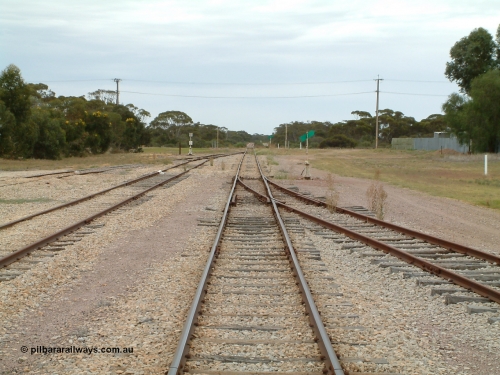 030407 094908
Minnipa, station yard overview looking north from the middle of the yard. Sidings 2 and 3 coming in from the left and Siding 1 on the right, point levers and indicators. Grade crossing in the distance. April 7, 2003.
