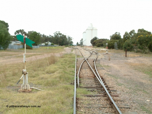 030407 095119
Minnipa, station yard overview looking south from the north end points, point levers and indicators for Sidings 1, 2 and 3 visible. Concrete silo complexes and rotating jib crane visible in the distance. April 7, 2003
