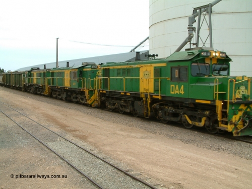 030407 114338
Poochera, empty grain train arrives behind a trio of former Australian National Co-Co locomotives with rebuilt former AE Goodwin ALCo model DL531 830 class ex 839, serial no. 83730, rebuilt by Port Augusta Workshops to DA class, DA 4 leading two AE Goodwin ALCo model DL531 830 class units 842, serial no. 84140 and 851 serial no. 84137, 851 having been on the Eyre Peninsula since delivered in 1962, to shunt off empty waggons and pick up the loaded ones. 7th April 2003.
Keywords: DA-class;DA4;83730;Port-Augusta-WS;ALCo;DL531G/1;830-class;839;rebuild;